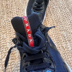 Prada Unisex Black and Red Sneakers